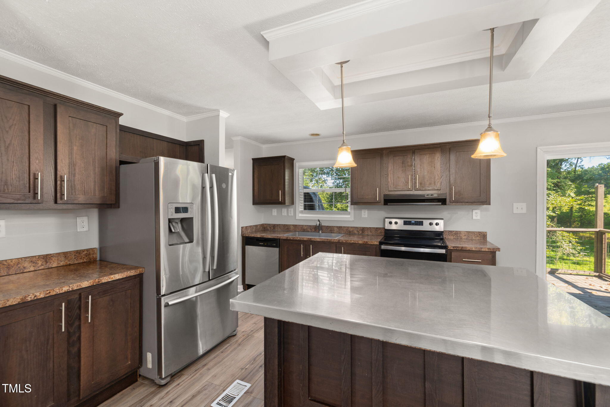 4073 Pine Ridge Road Franklinton, NC 27525 - Photo 6 of 24 a kitchen with a refrigerator a stove a microwave and wooden floor