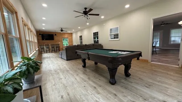 a kitchen with refrigerator and microwave