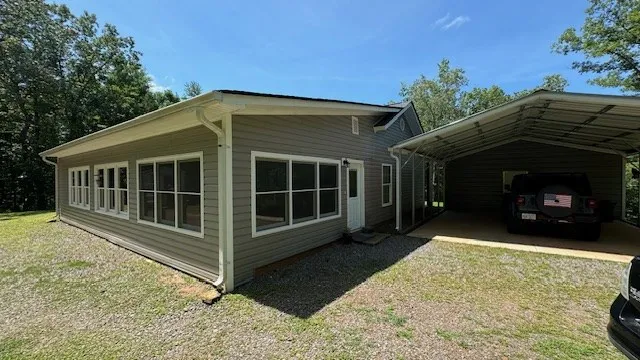 a view of a house with a yard