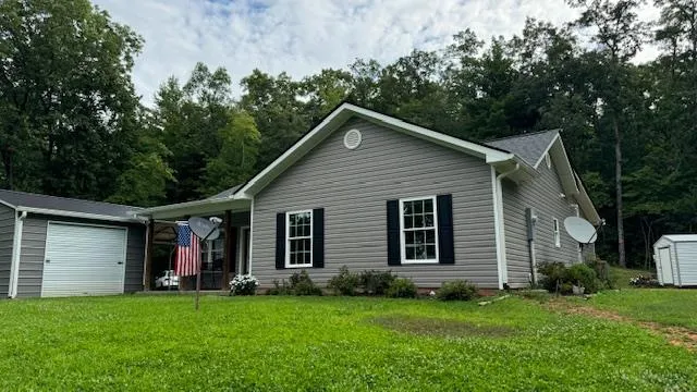 a view of backyard with deck and backyard