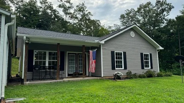 a backyard of a house with lots of green space