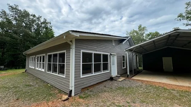 a bathroom with a sink a toilet and a shower