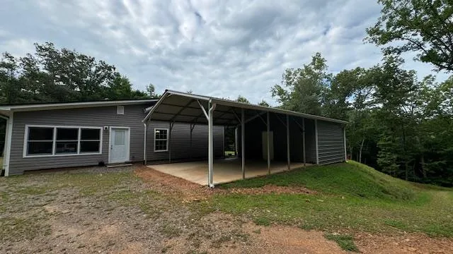 a view of a closet with wooden floor
