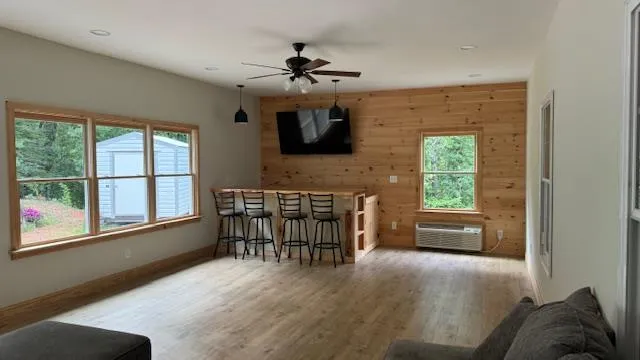a livingroom with furniture window and wooden floor