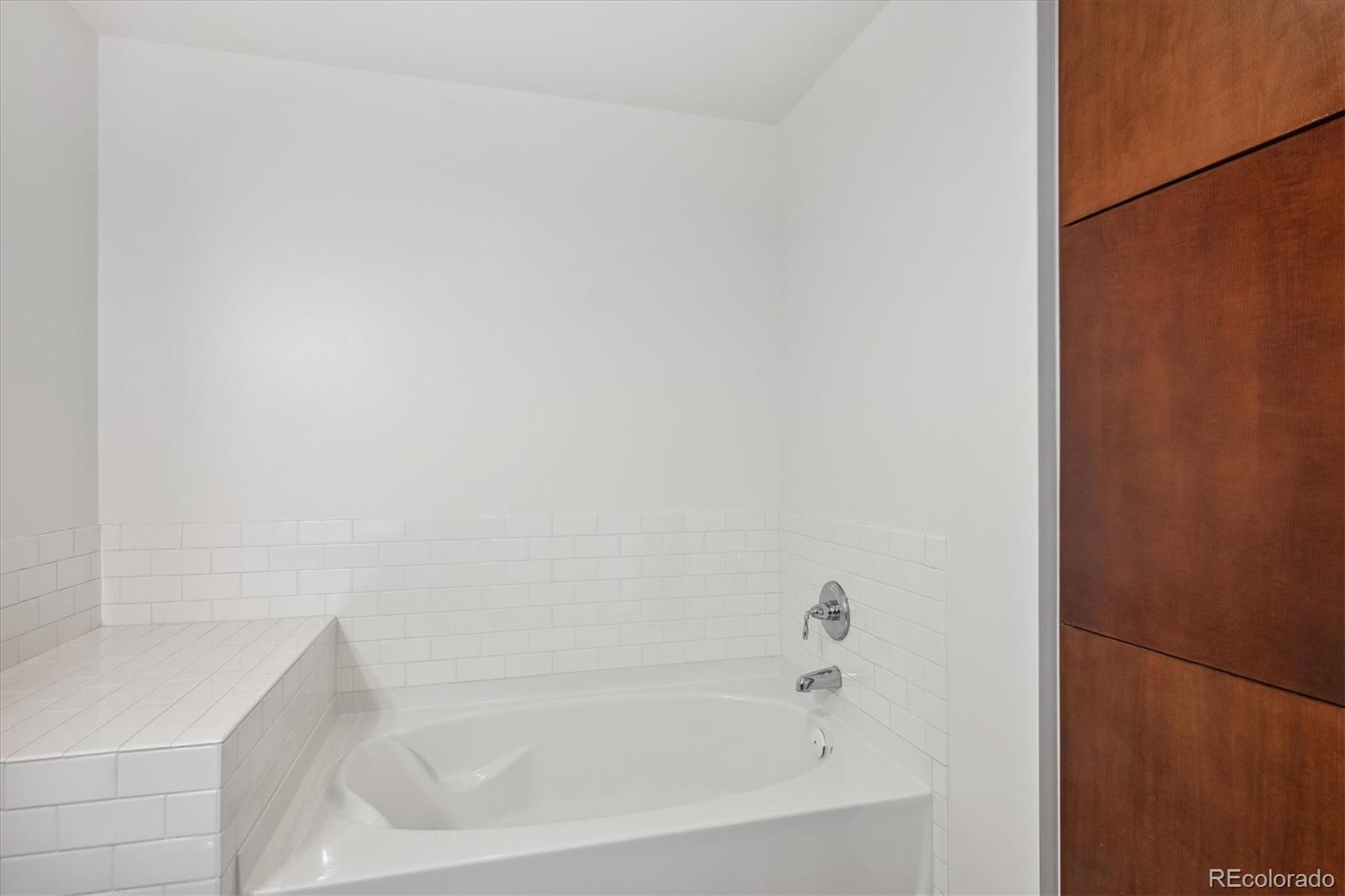 2990 East 17th Avenue, Unit 803 Denver, CO 80206 - Photo 13 of 29 a bathroom with a bathtub