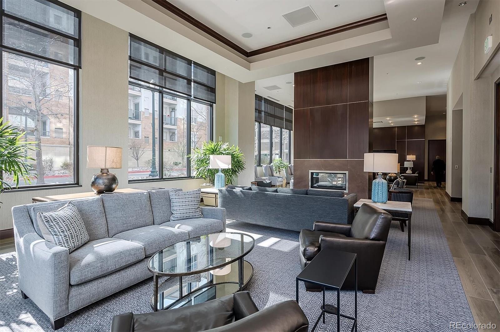 2990 East 17th Avenue, Unit 803 Denver, CO 80206 - Photo 27 of 29 a living room with furniture and a large window