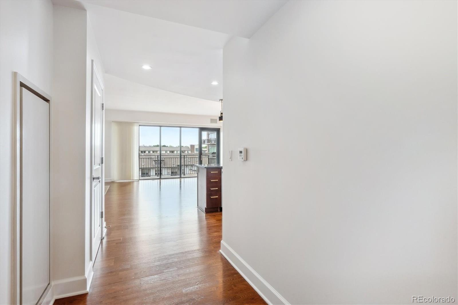2990 East 17th Avenue, Unit 803 Denver, CO 80206 - Photo 6 of 29 a view of an entryway with wooden floor