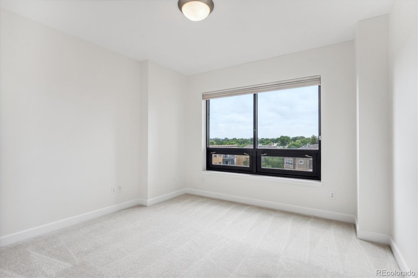 2990 East 17th Avenue, Unit 803 Denver, CO 80206 - Photo 10 of 29 a view of an empty room with a window