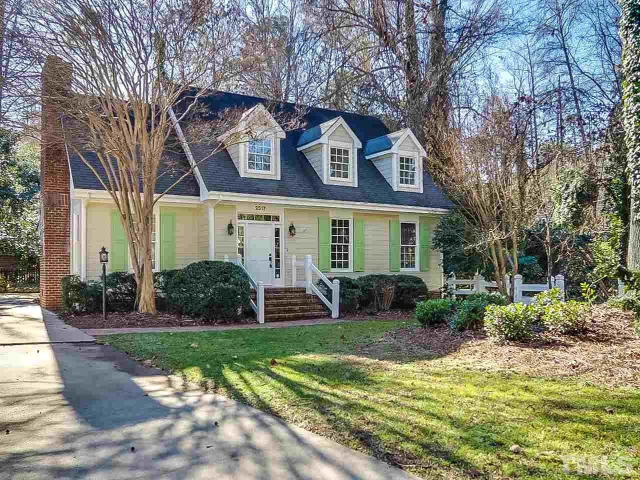 2517 Winterbury Court Raleigh, NC 27607 - Photo 1 of 24 a front view of a house with garden and porch