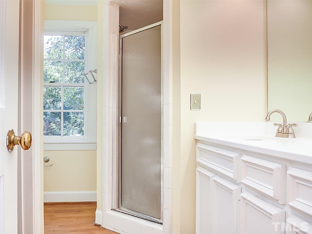 2517 Winterbury Court Raleigh, NC 27607 - Photo 13 of 24 a bathroom with a sink and a mirror