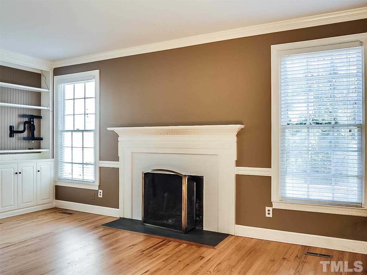 2517 Winterbury Court Raleigh, NC 27607 - Photo 5 of 24 a view of a livingroom with a fireplace and window