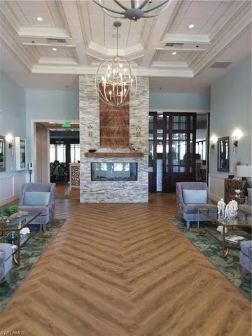 a living room with lots of furniture and gym equipment