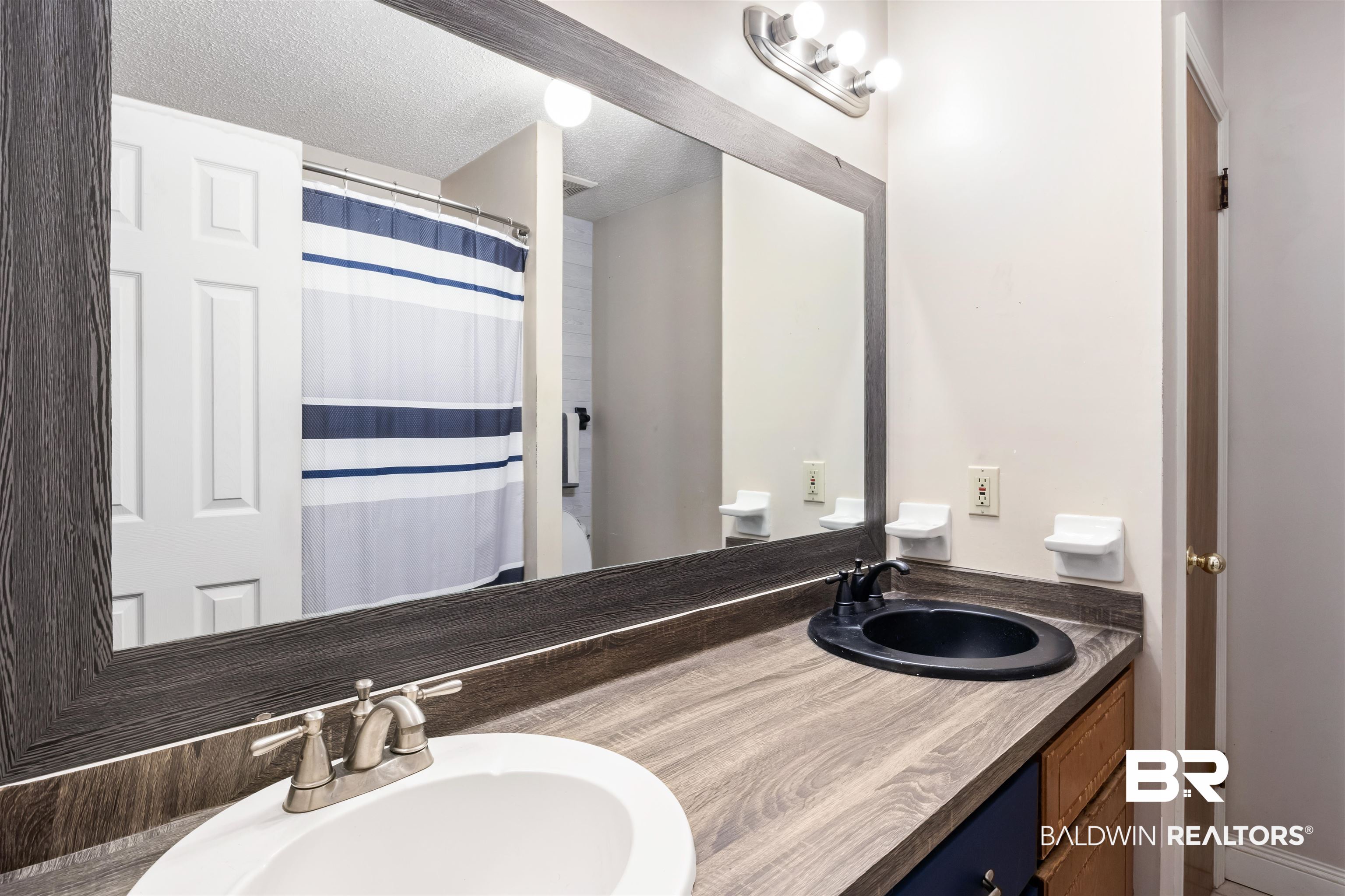 1345 Baker Court Mobile, AL 36695 - Photo 13 of 28 Bathroom featuring dual vanity, a textured ceiling, and toilet