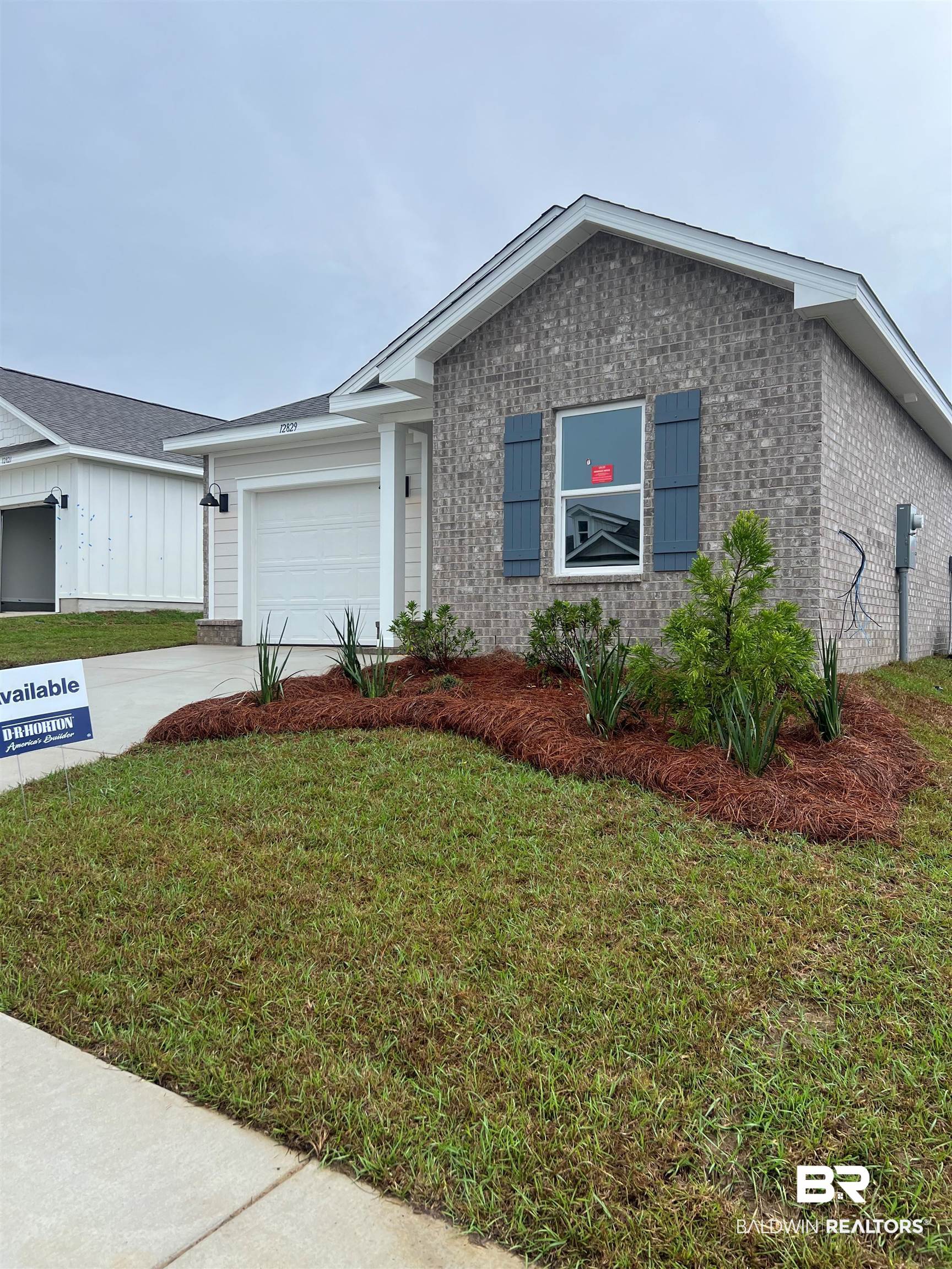 12829 Patriot Way Daphne, AL 36527 - Photo 3 of 38 View of front of home with a garage and a front yard
