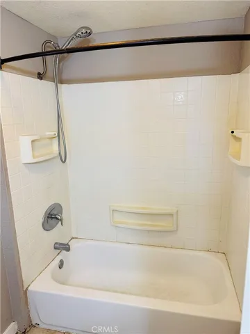 a bathroom with a bath tub and a shower