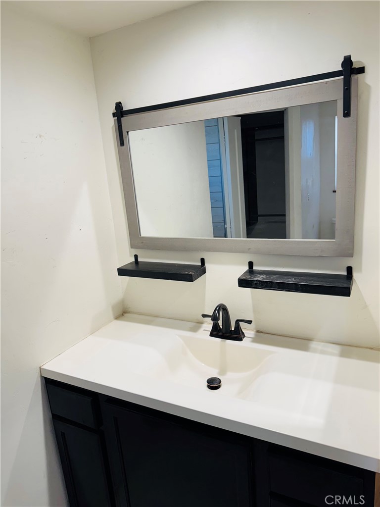 2206 Buckman Springs Road Campo, CA 91906 - Photo 16 of 29 a bathroom with a sink and a mirror