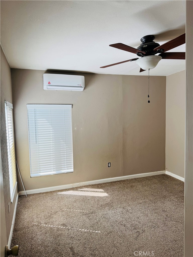 2206 Buckman Springs Road Campo, CA 91906 - Photo 10 of 29 an empty room with a ceiling fan and closet