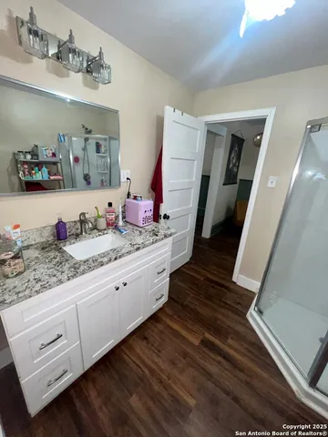 a bathroom with sink and mirror