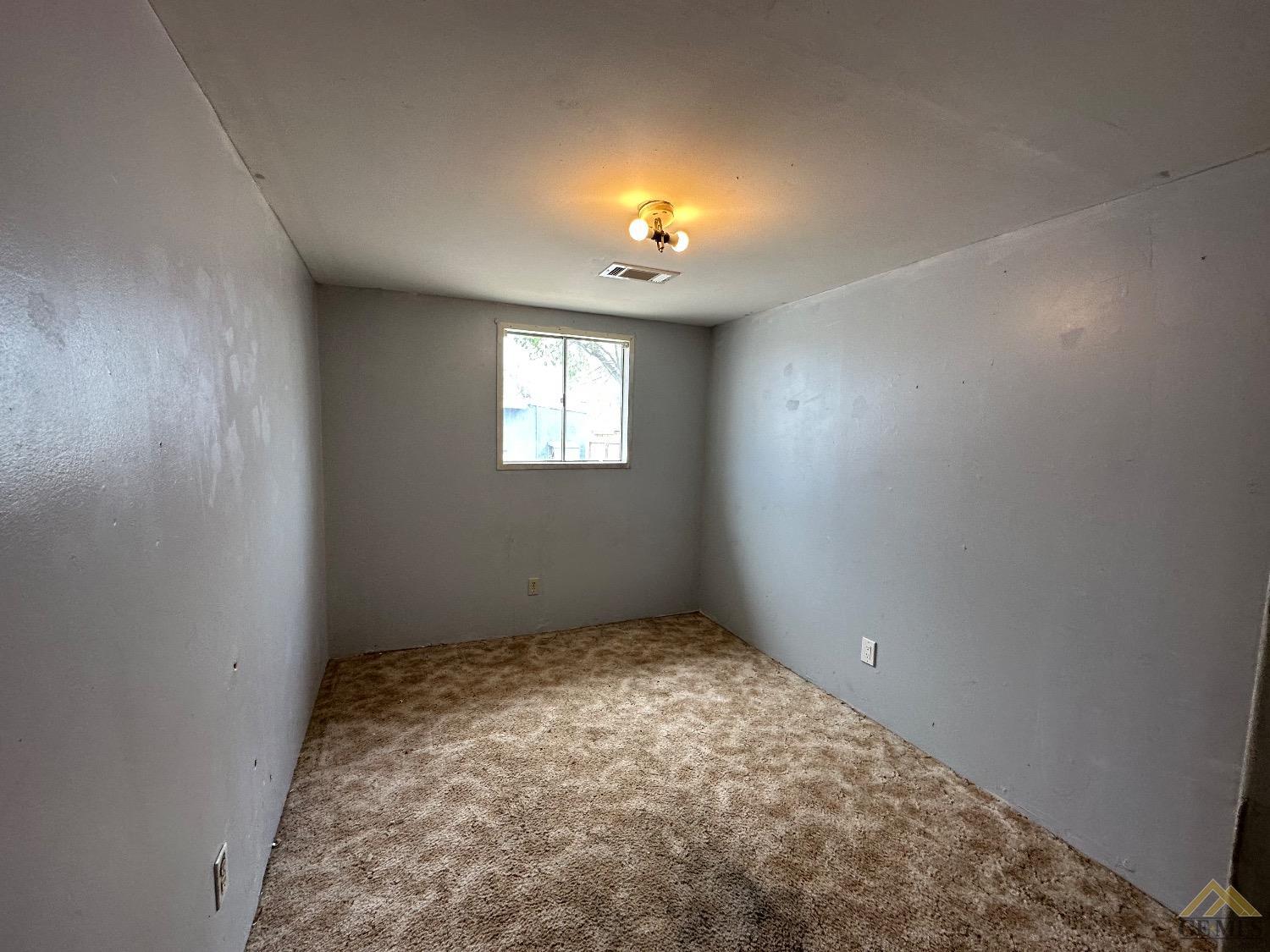 Undisclosed Address Taft, CA 93268 - Photo 13 of 22 an empty room with windows
