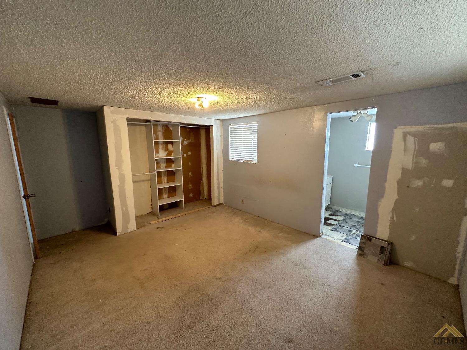 Undisclosed Address Taft, CA 93268 - Photo 16 of 22 an empty room with a bathroom and closet