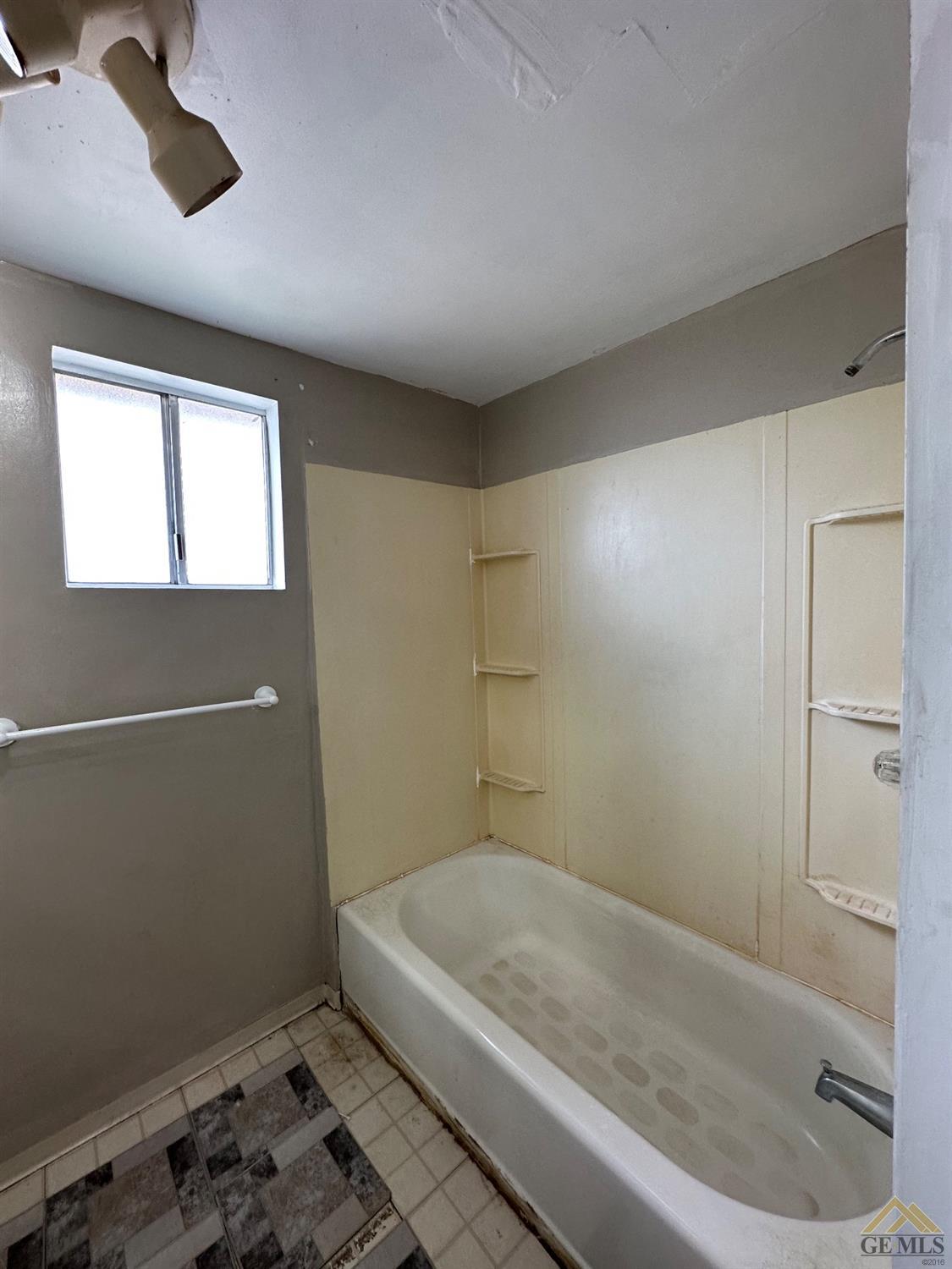 Undisclosed Address Taft, CA 93268 - Photo 17 of 22 a bathroom with a window and a shower