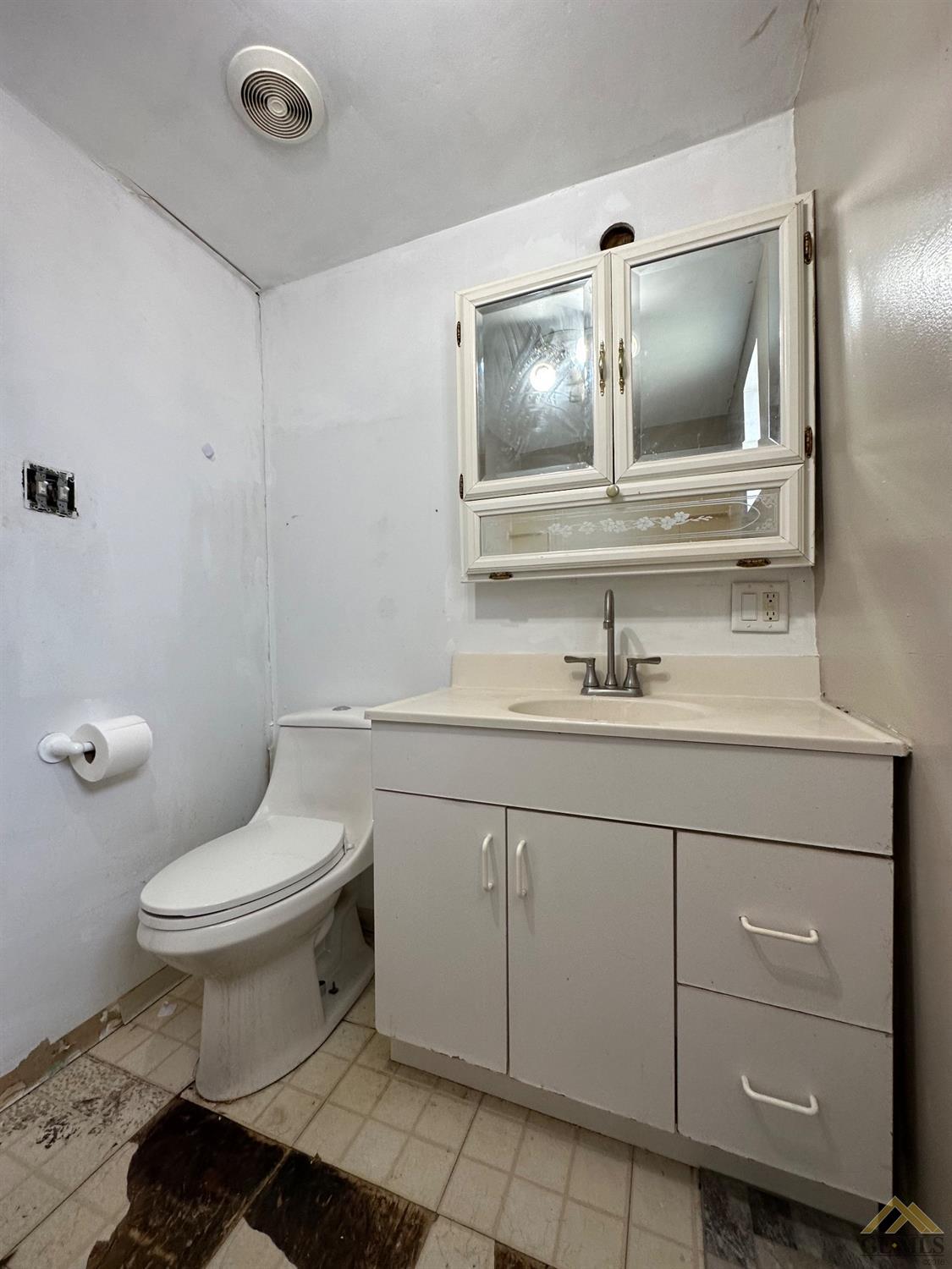 Undisclosed Address Taft, CA 93268 - Photo 18 of 22 a bathroom with a toilet sink and mirror