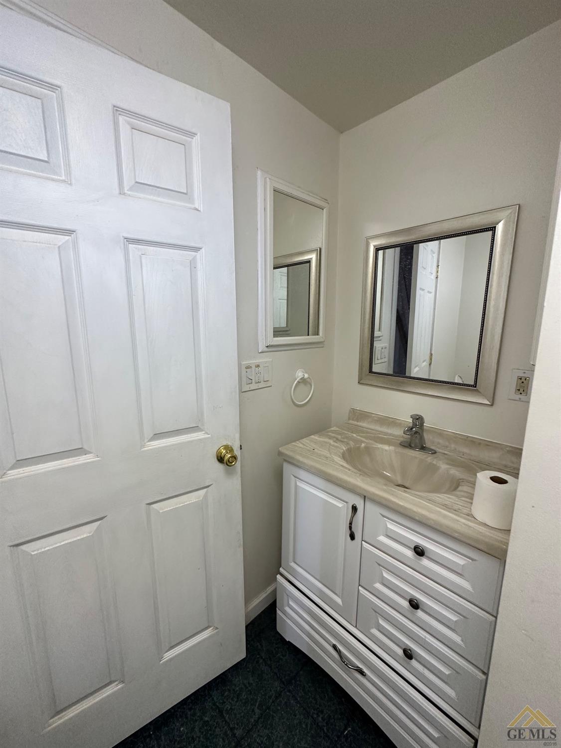 Undisclosed Address Taft, CA 93268 - Photo 6 of 22 a bathroom with a granite countertop sink and a mirror