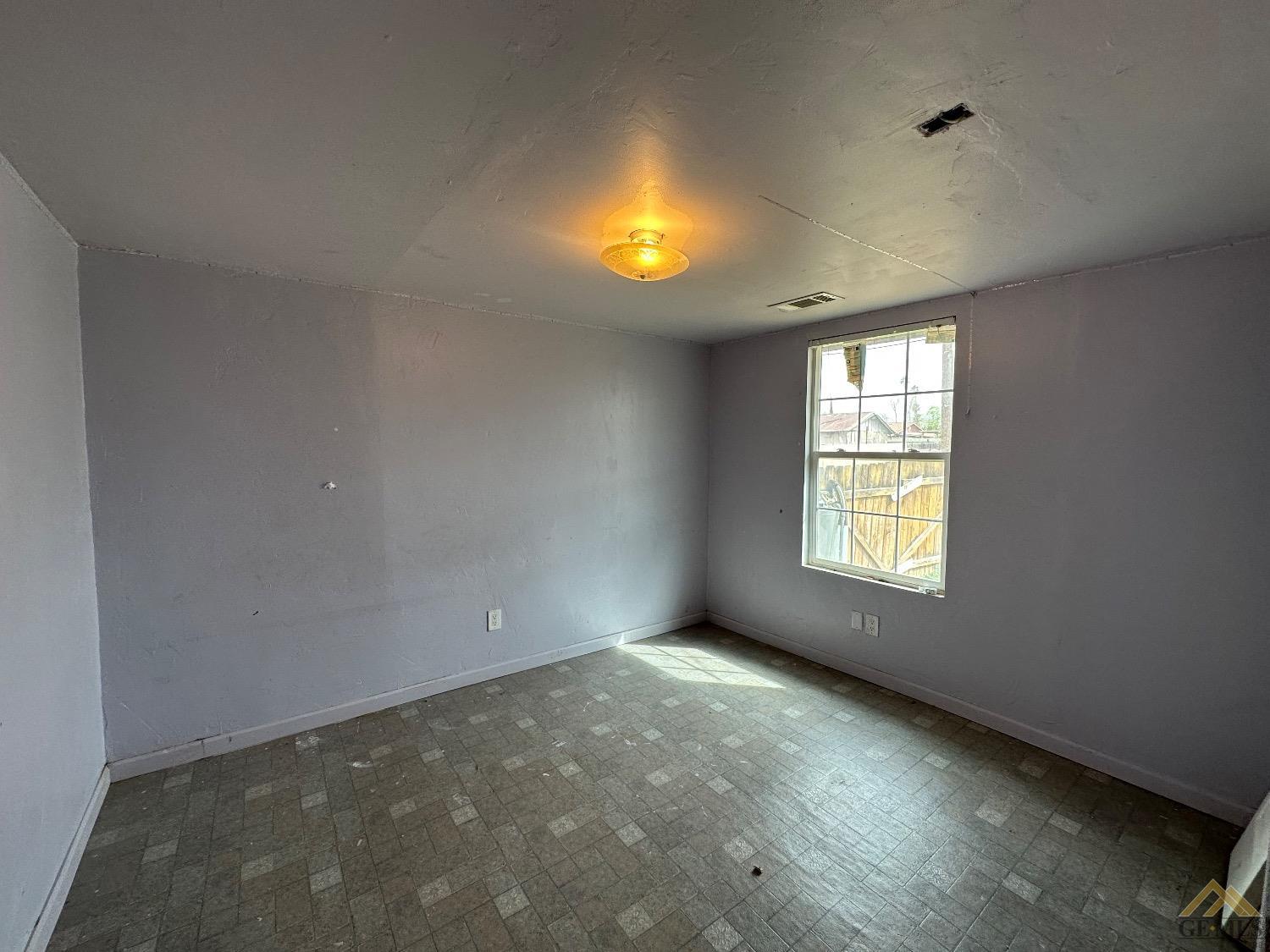 Undisclosed Address Taft, CA 93268 - Photo 10 of 22 a view of an empty room with a window