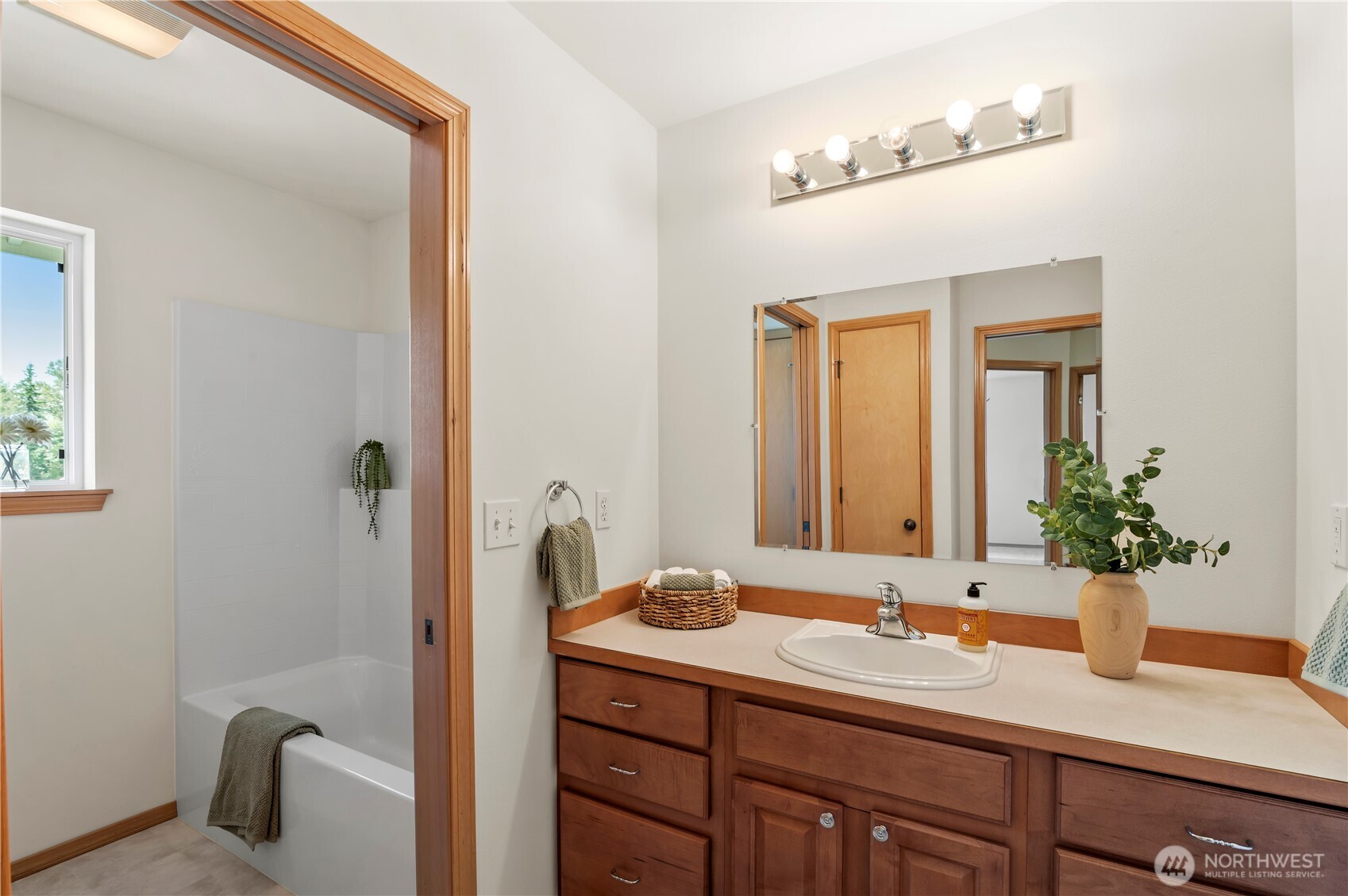 18927 Fales Road Snohomish, WA 98296 - Photo 14 of 18 a bathroom with a granite countertop sink mirror and a toilet