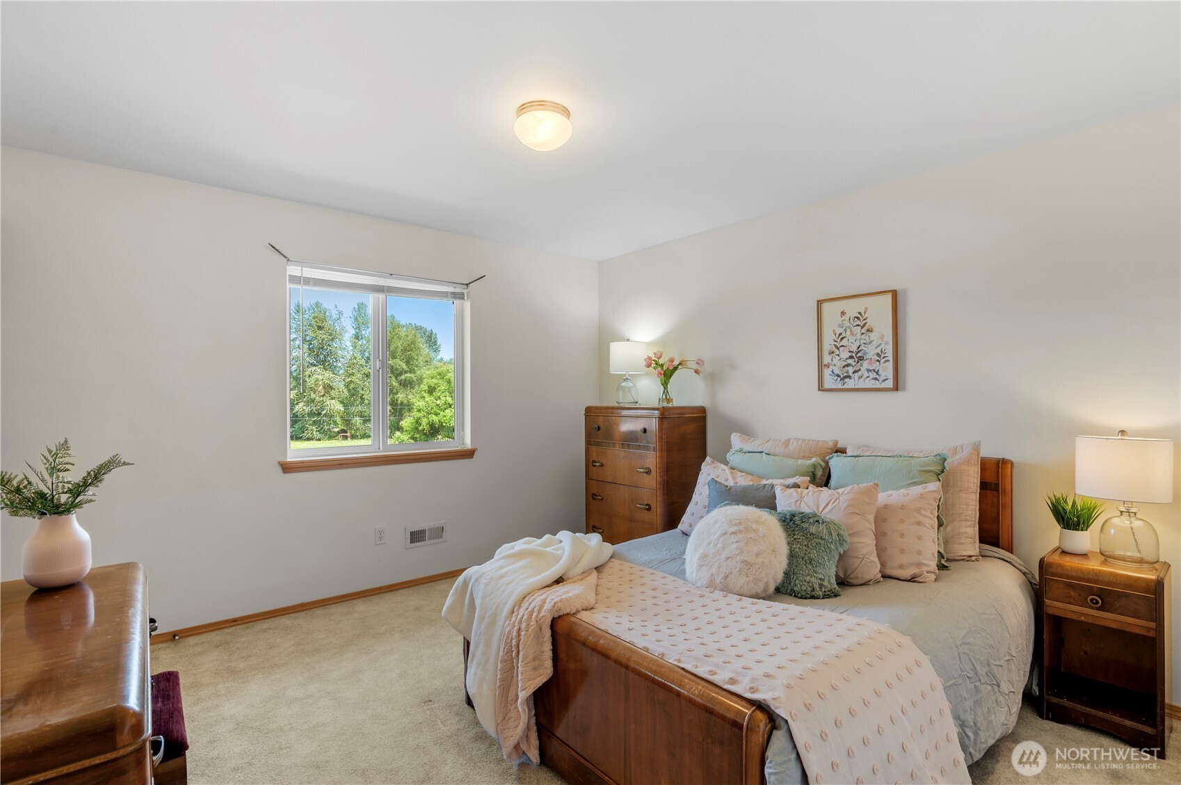 18927 Fales Road Snohomish, WA 98296 - Photo 9 of 18 a bed room with a bed and a lamp