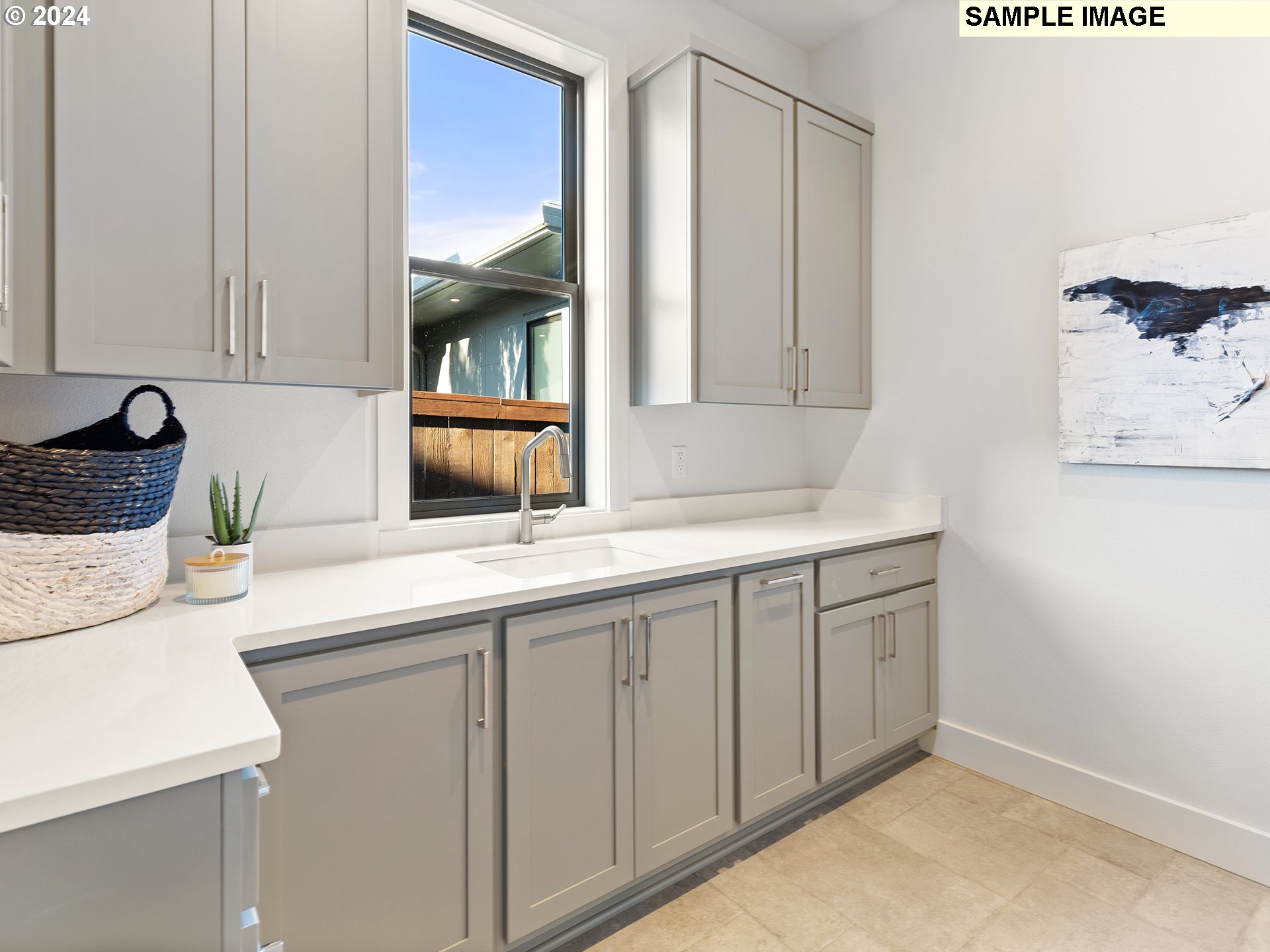 17207 Northwest 7th Avenue Ridgefield, WA 98642 - Photo 14 of 16 a kitchen with a sink and cabinets