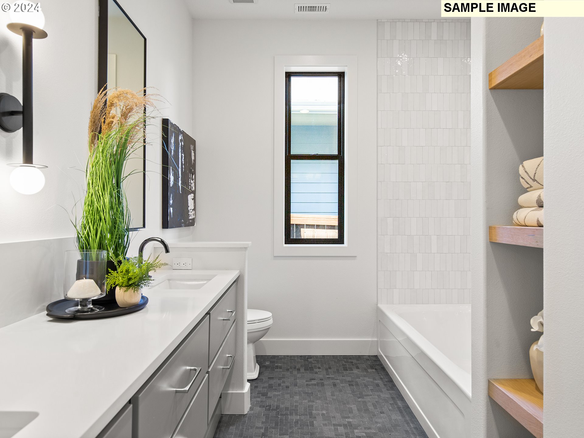 17207 Northwest 7th Avenue Ridgefield, WA 98642 - Photo 15 of 16 a bathroom with a sink a toilet and mirror