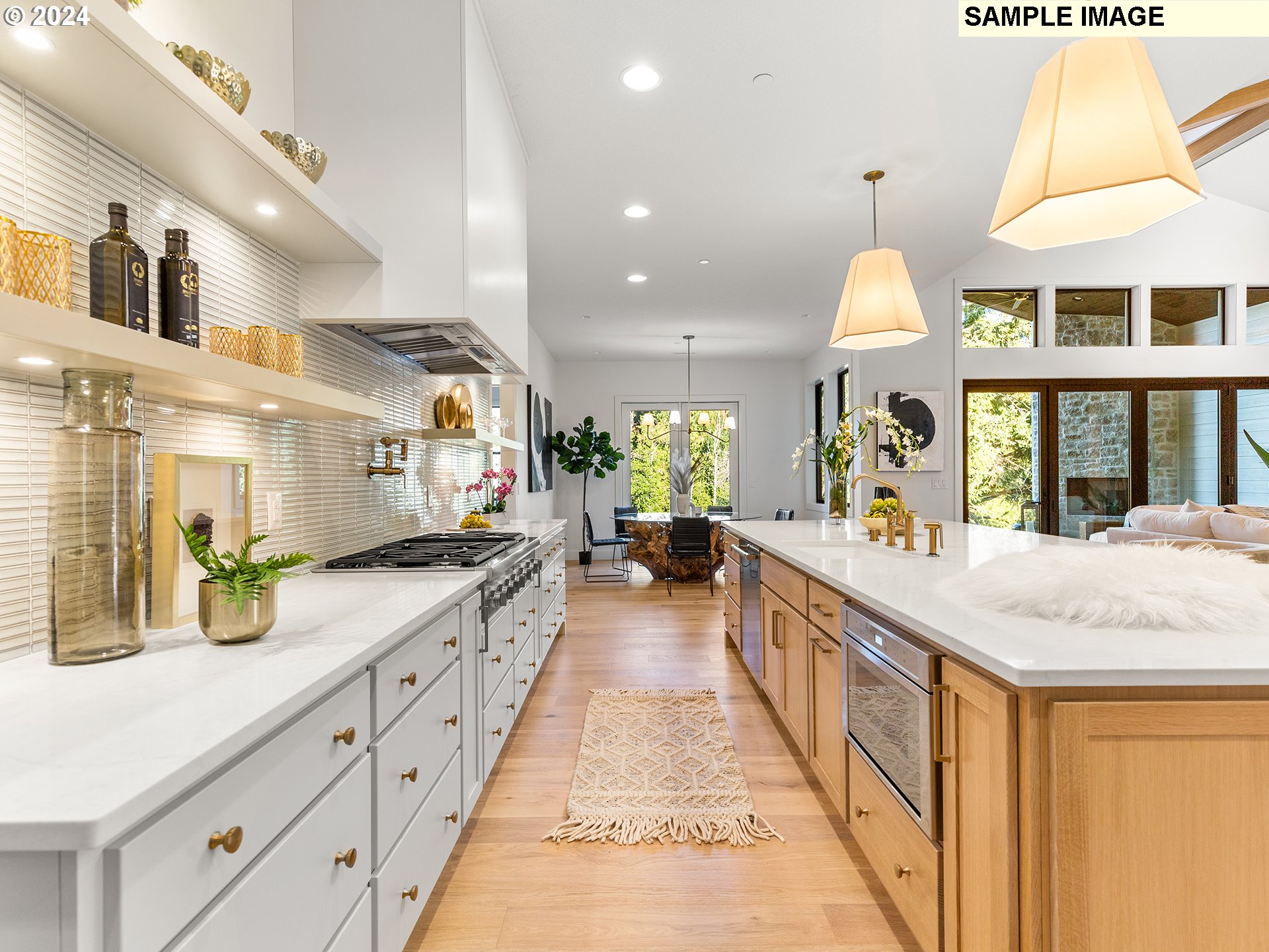 17207 Northwest 7th Avenue Ridgefield, WA 98642 - Photo 8 of 16 a large kitchen with stainless steel appliances kitchen island a large counter space