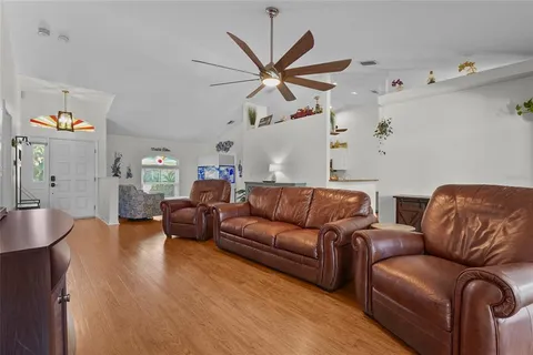 a living room with furniture and windows
