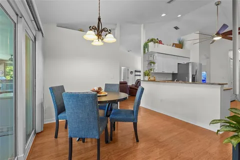 a bedroom with bed and a chandelier