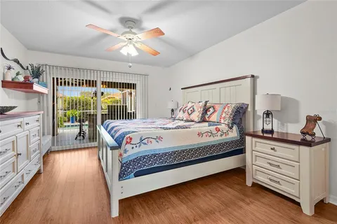 a kids bedroom with a bed and a chandelier