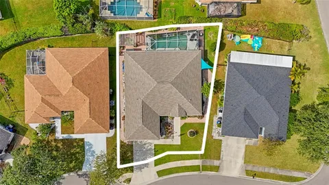 an aerial view of a house with swimming pool