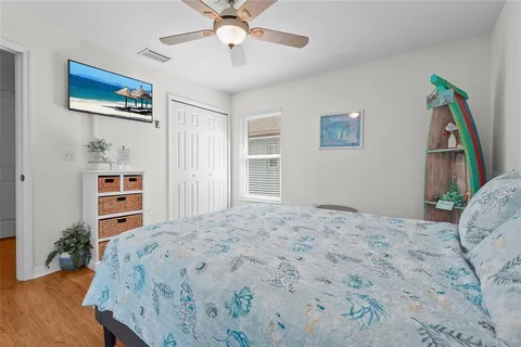 a living room with furniture a chandelier and a dining table