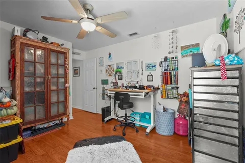 a kitchen with stainless steel appliances granite countertop table chairs and a large window