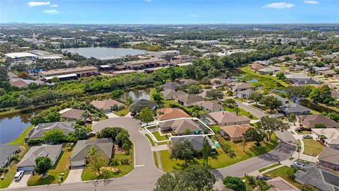 an aerial view of residential building and lake