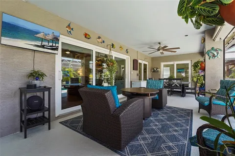 a view of a patio with swimming pool table and chairs