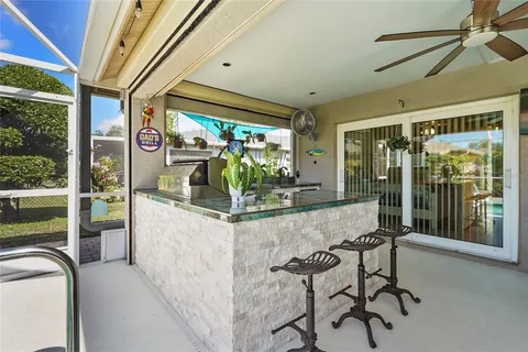 a backyard of a house with a fountain and a fire pit