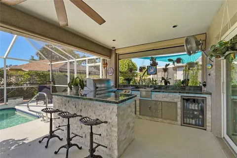 a front view of a multi story residential apartment building with yard and retail shops