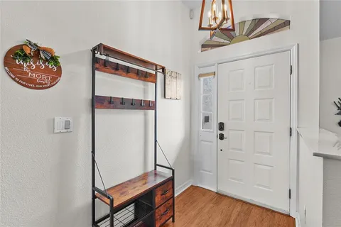a living room with furniture window and wooden floor