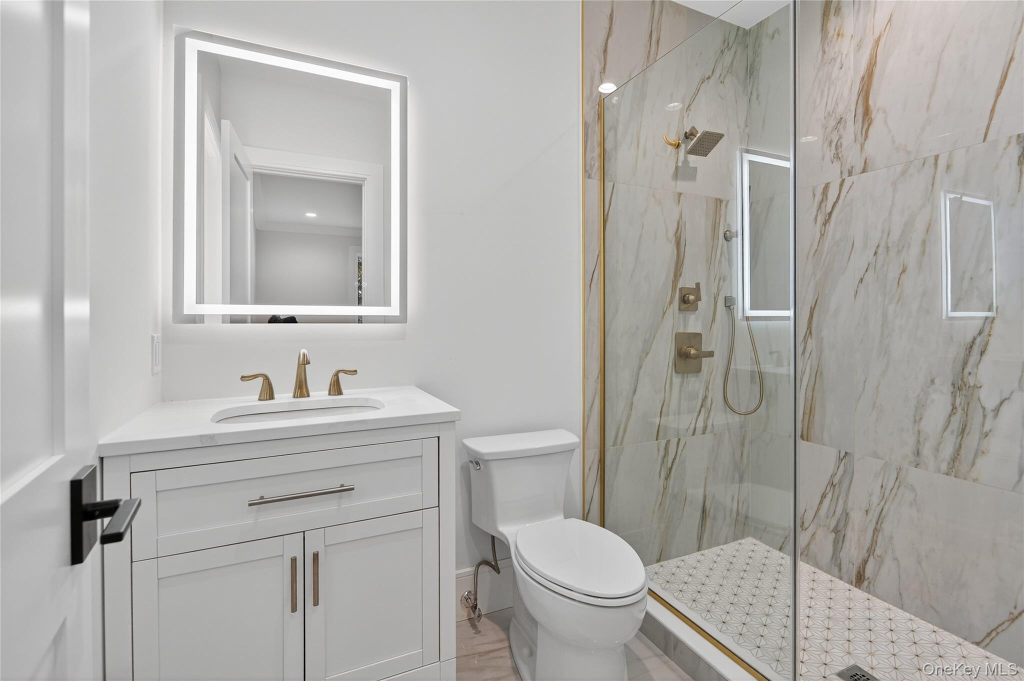 654 Caledonia Road Dix Hills, NY 11746 - Photo 20 of 42 Bathroom with a marble finish shower and vanity
