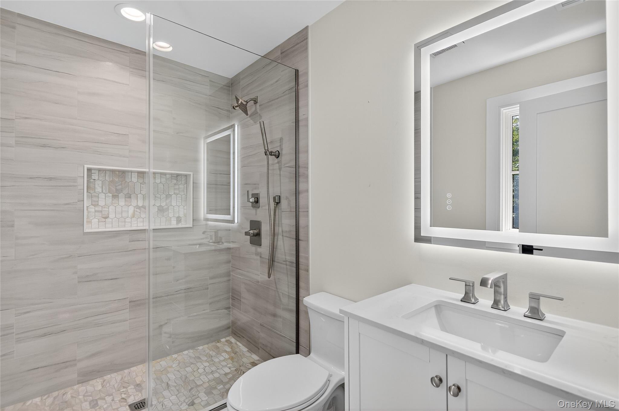 654 Caledonia Road Dix Hills, NY 11746 - Photo 27 of 42 Full bathroom with vanity, a walk in shower, and recessed lighting