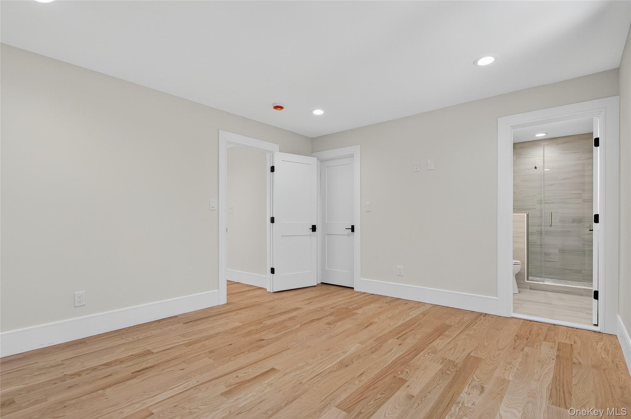 654 Caledonia Road Dix Hills, NY 11746 - Photo 28 of 42 Unfurnished bedroom with light wood-type flooring, recessed lighting, and connected bathroom
