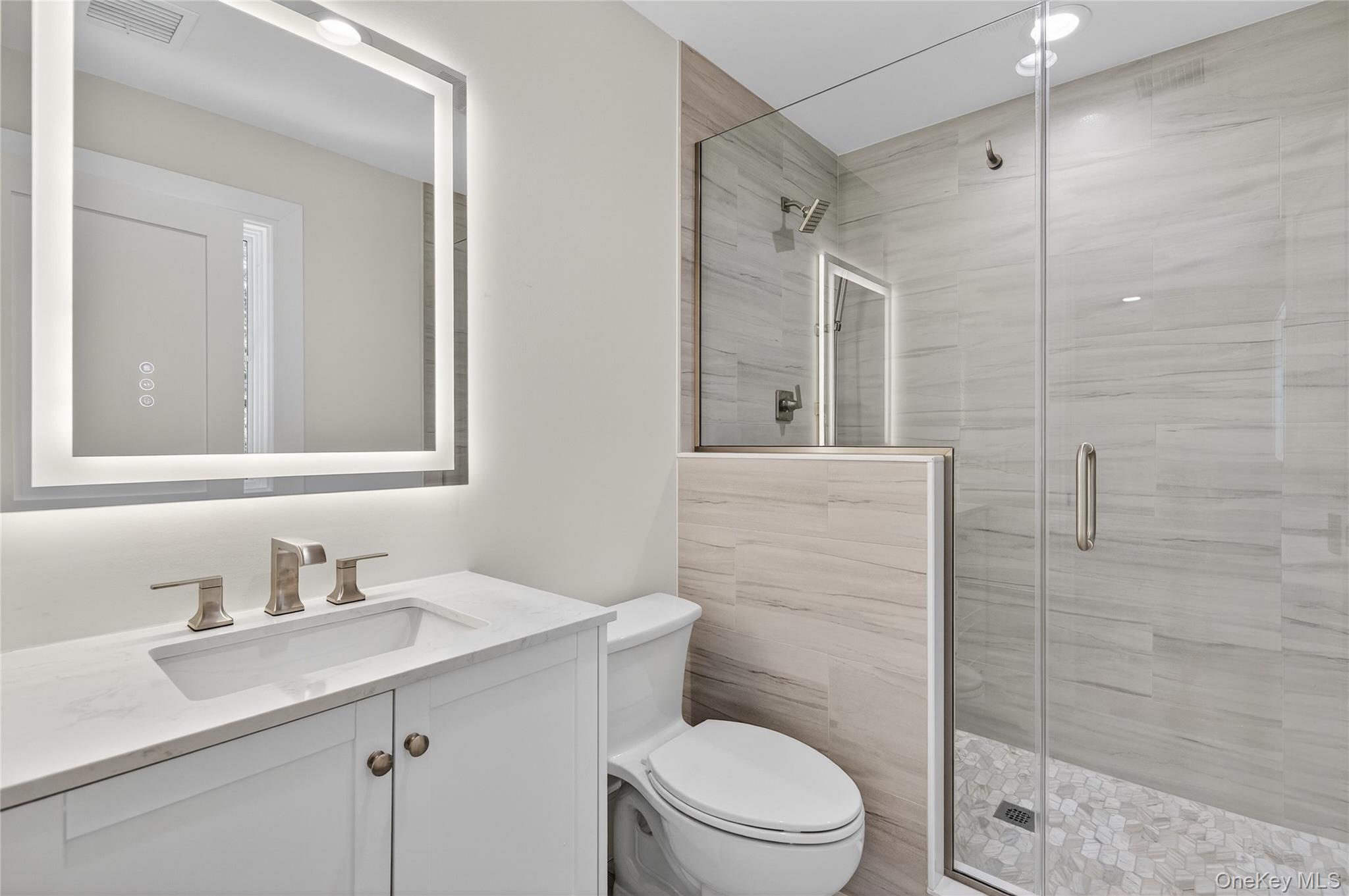 654 Caledonia Road Dix Hills, NY 11746 - Photo 29 of 42 Bathroom with a shower stall and vanity