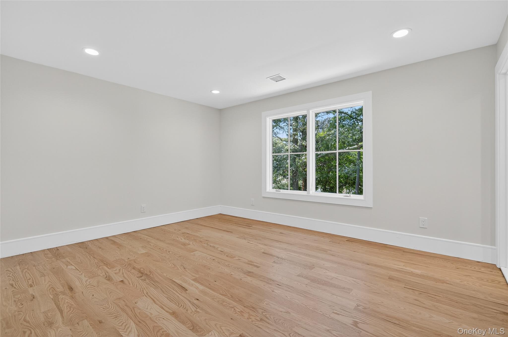654 Caledonia Road Dix Hills, NY 11746 - Photo 30 of 42 Empty room featuring recessed lighting and light wood-style flooring