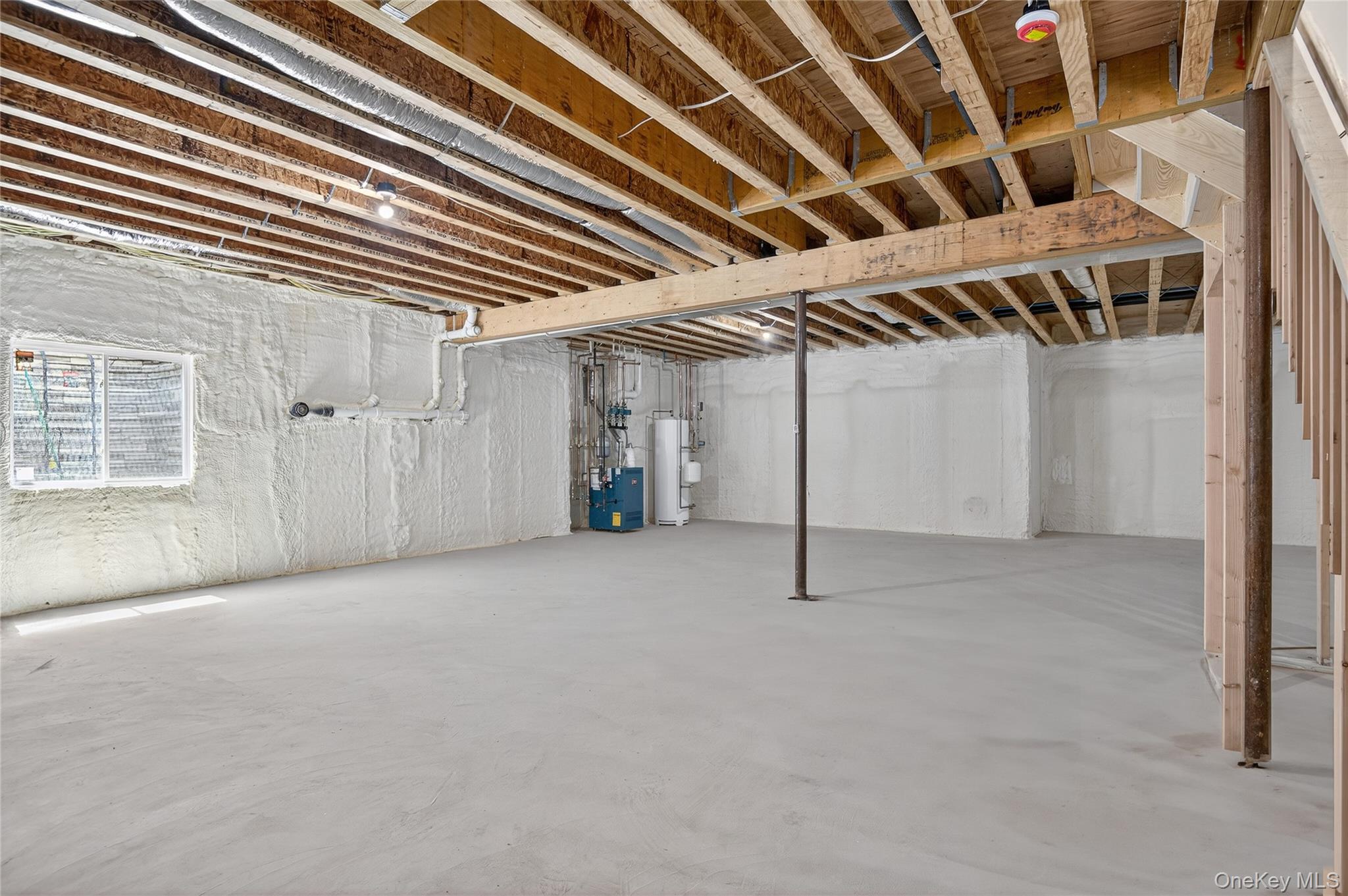 654 Caledonia Road Dix Hills, NY 11746 - Photo 35 of 42 Unfinished below grade area with water heater and a heating unit